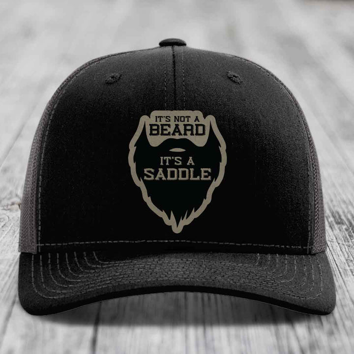 Its Not A Beard, Its A Saddle - Leather Patch Hat - Light Brown to Black Patch - Richardson 112 Snapback Trucker Hat