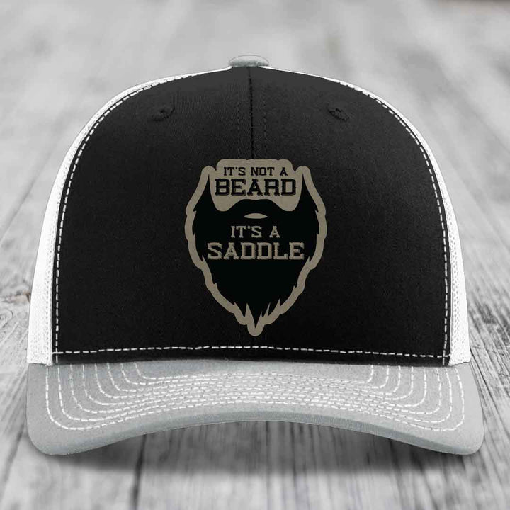 Its Not A Beard, Its A Saddle - Leather Patch Hat - Light Brown to Black Patch - Richardson 112 Snapback Trucker Hat