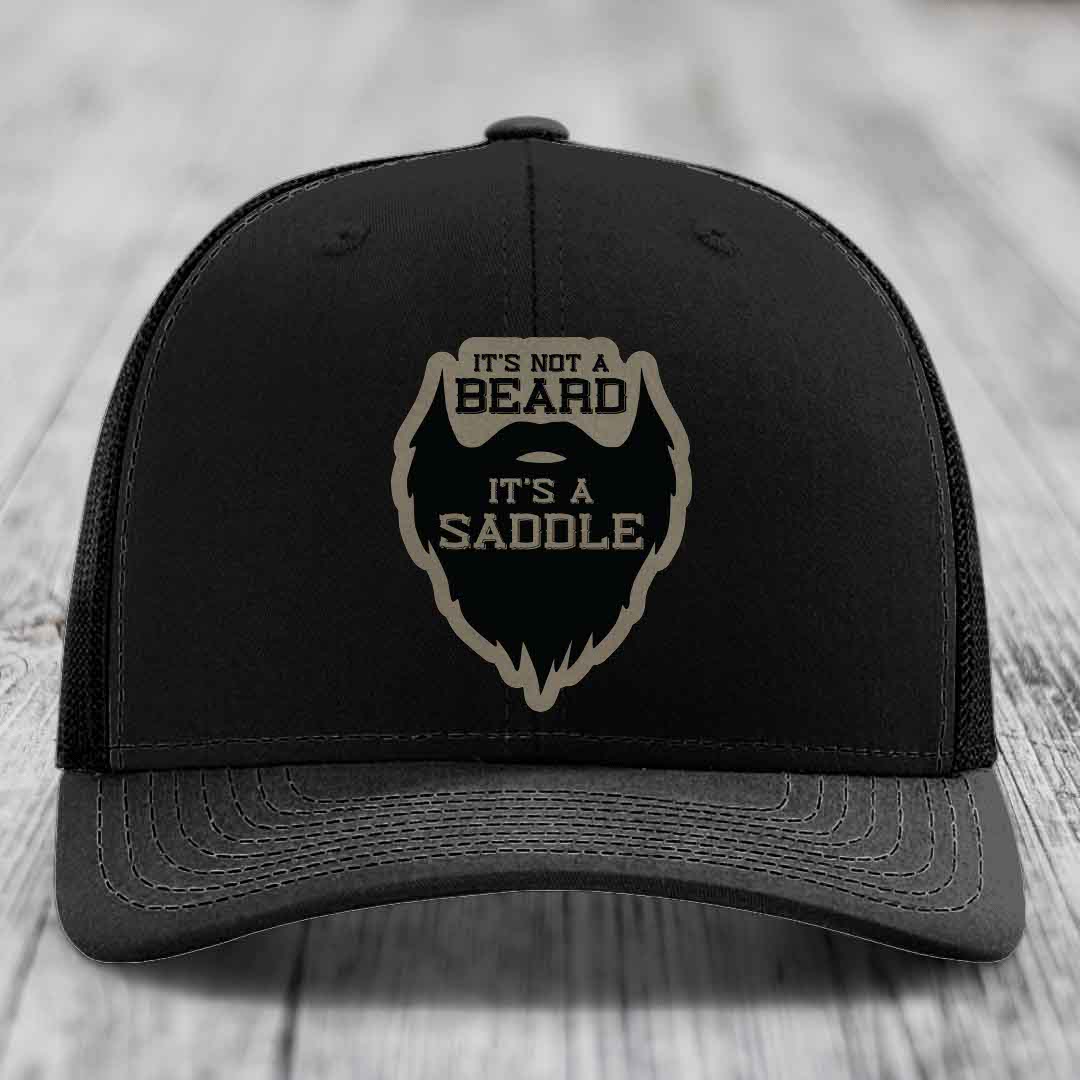 Its Not A Beard, Its A Saddle - Leather Patch Hat - Light Brown to Black Patch - Richardson 112 Snapback Trucker Hat