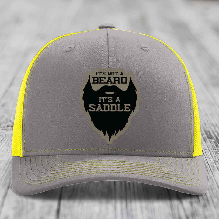 Its Not A Beard, Its A Saddle - Leather Patch Hat - Light Brown to Black Patch - Richardson 112 Snapback Trucker Hat