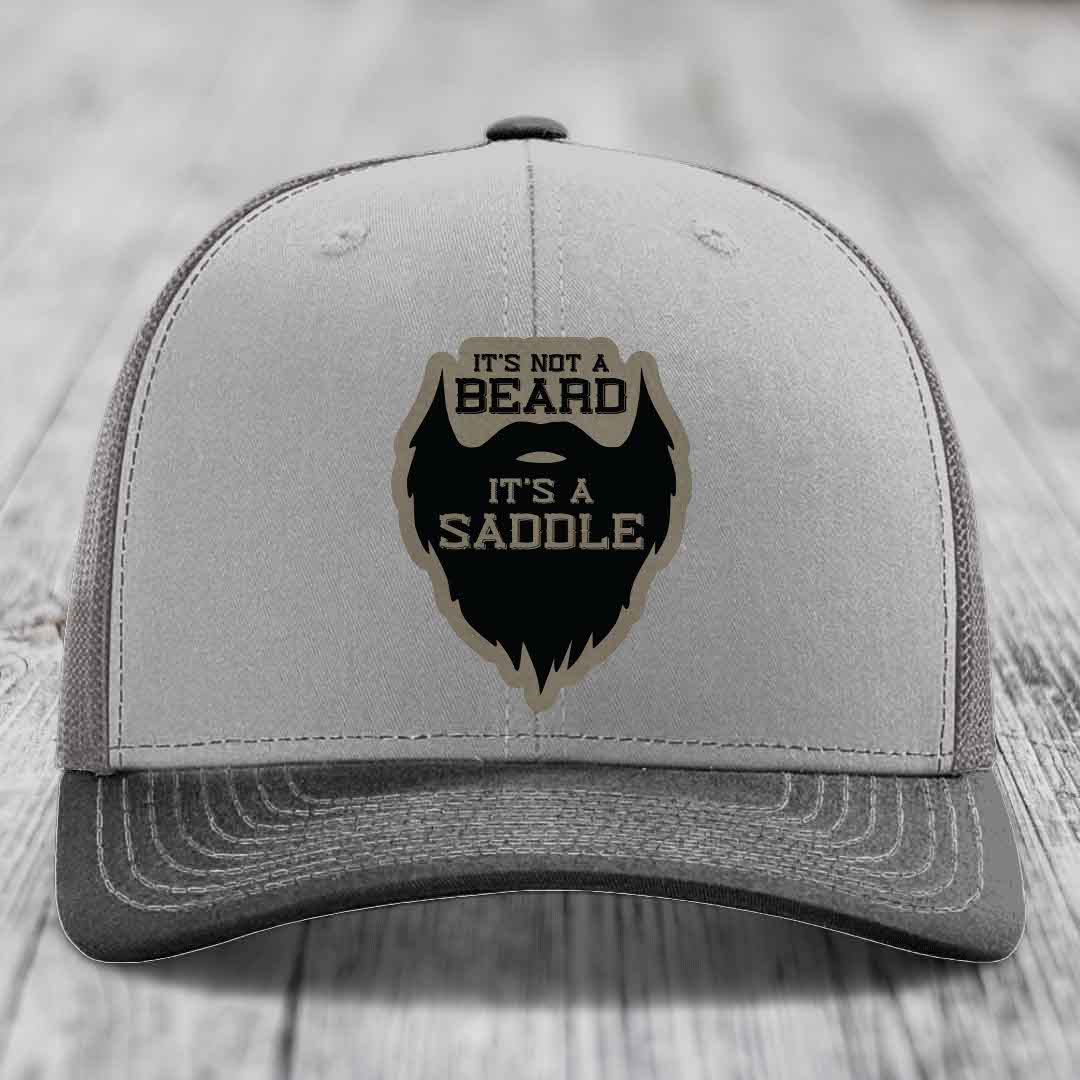 Its Not A Beard, Its A Saddle - Leather Patch Hat - Light Brown to Black Patch - Richardson 112 Snapback Trucker Hat