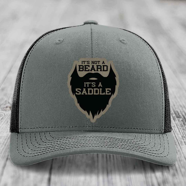Its Not A Beard, Its A Saddle - Leather Patch Hat - Light Brown to Black Patch - Richardson 112 Snapback Trucker Hat