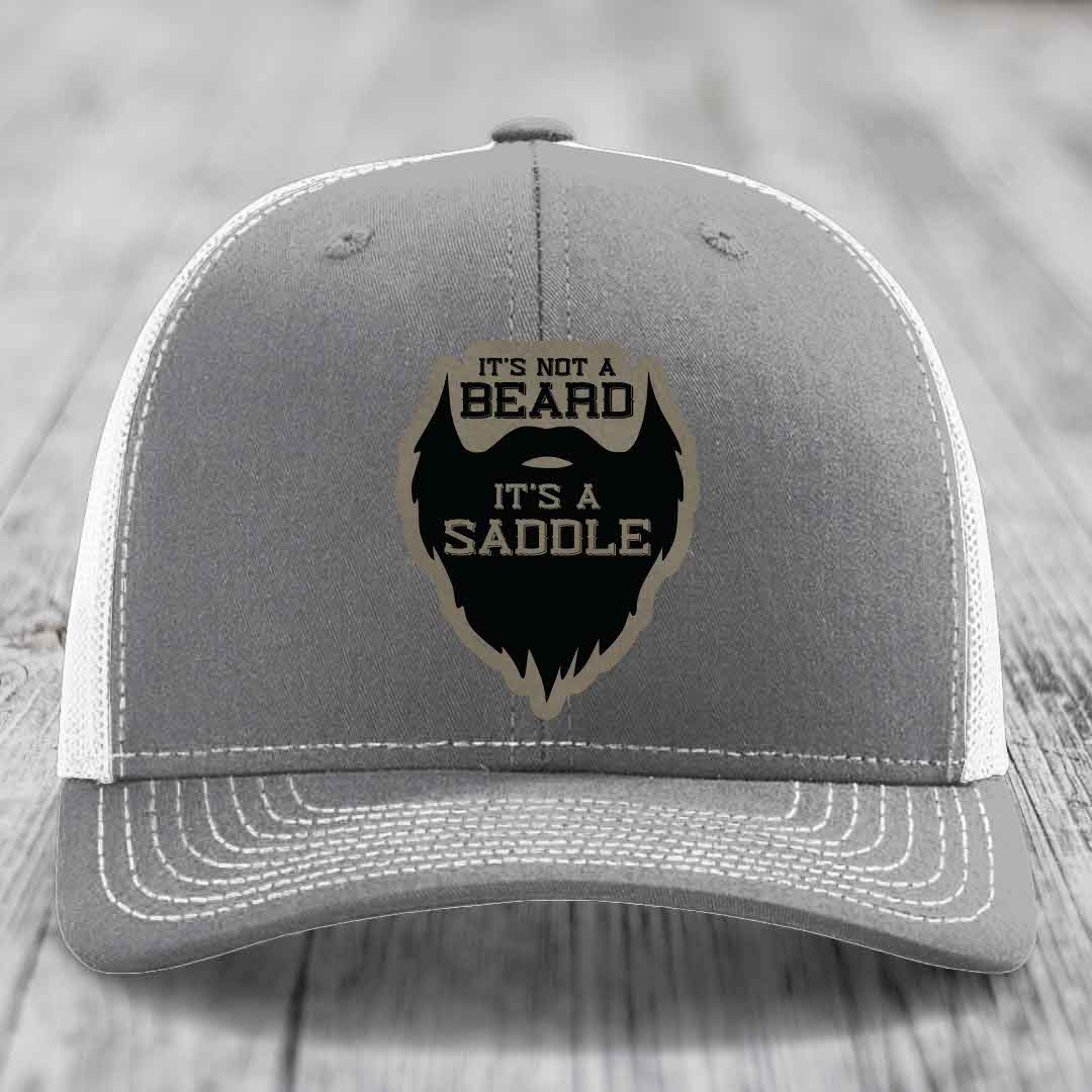 Its Not A Beard, Its A Saddle - Leather Patch Hat - Light Brown to Black Patch - Richardson 112 Snapback Trucker Hat