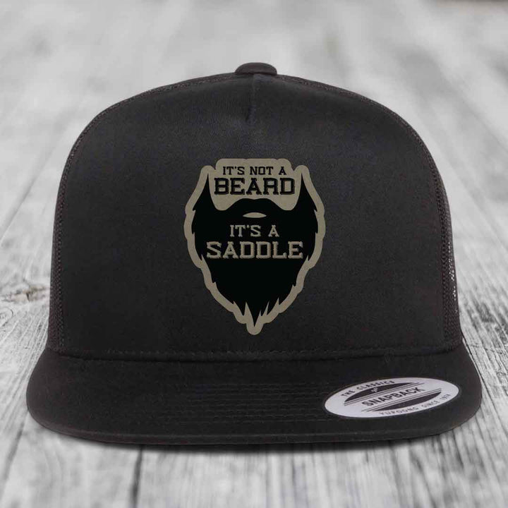 Its Not A Beard, Its A Saddle - Leather Patch Hat - Light Brown to Black Patch - Yupoong 6006 Snapback Flatbill Hat