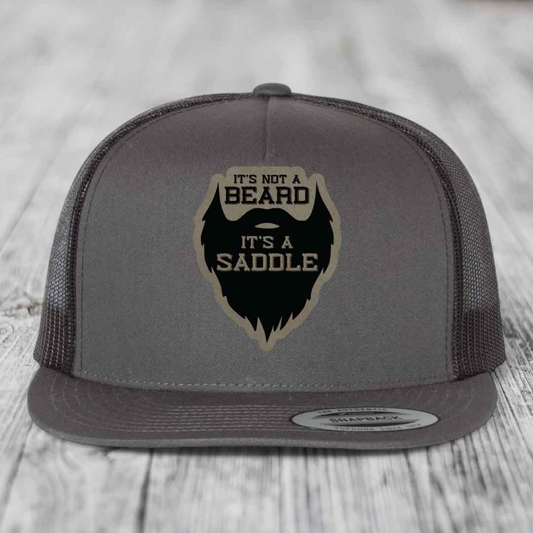Its Not A Beard, Its A Saddle - Leather Patch Hat - Light Brown to Black Patch - Yupoong 6006 Snapback Flatbill Hat