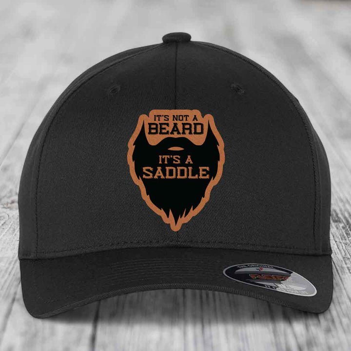 Its Not A Beard, Its A Saddle - Leather Patch Hat - Rawhide to Black Patch - Flexfit 6277 Fitted Hat