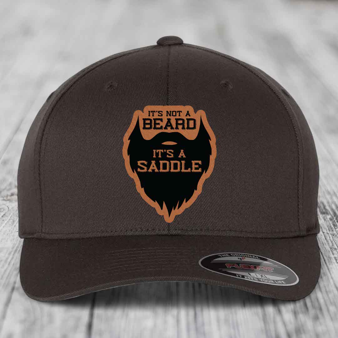 Its Not A Beard, Its A Saddle - Leather Patch Hat - Rawhide to Black Patch - Flexfit 6277 Fitted Hat