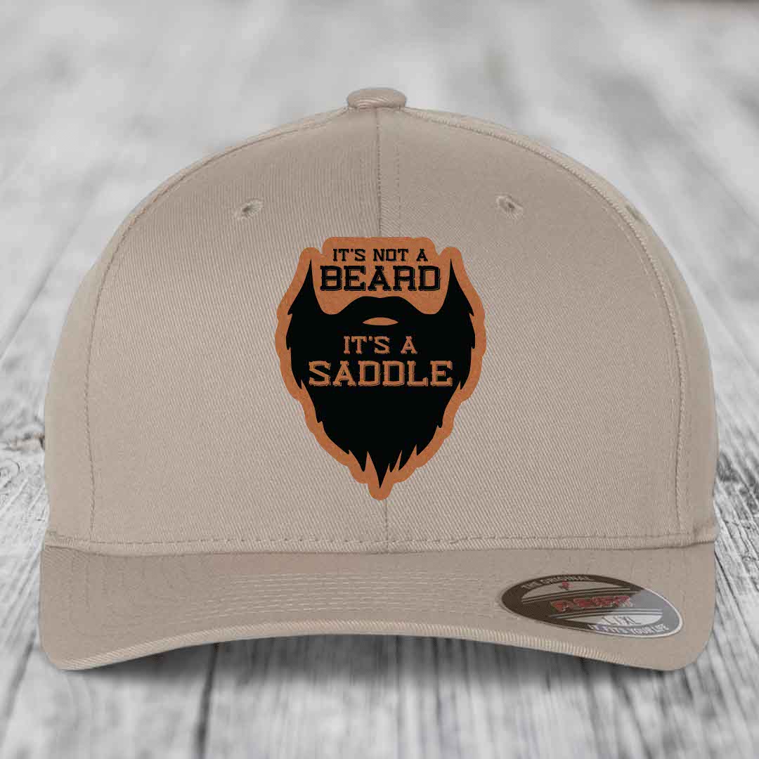 Its Not A Beard, Its A Saddle - Leather Patch Hat - Rawhide to Black Patch - Flexfit 6277 Fitted Hat