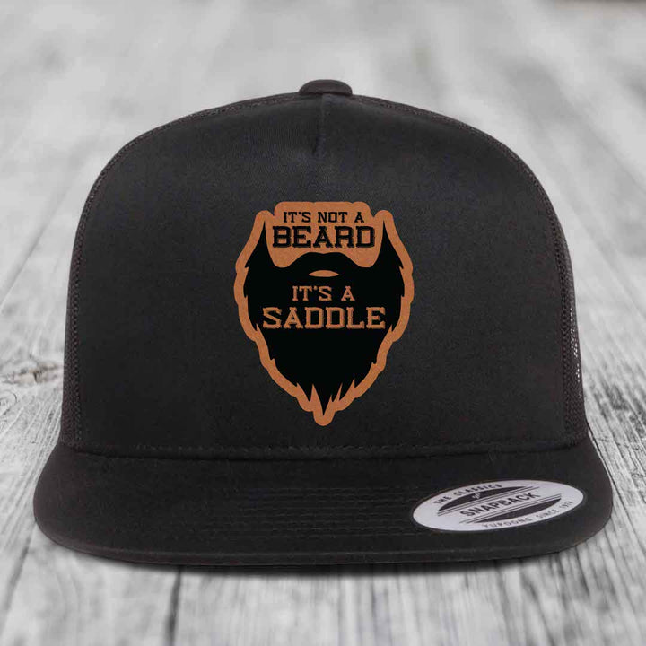 Its Not A Beard, Its A Saddle - Leather Patch Hat - Rawhide to Black Patch - Yupoong 6006 Snapback Flatbill Hat