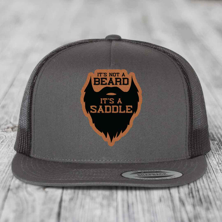 Its Not A Beard, Its A Saddle - Leather Patch Hat - Rawhide to Black Patch - Yupoong 6006 Snapback Flatbill Hat
