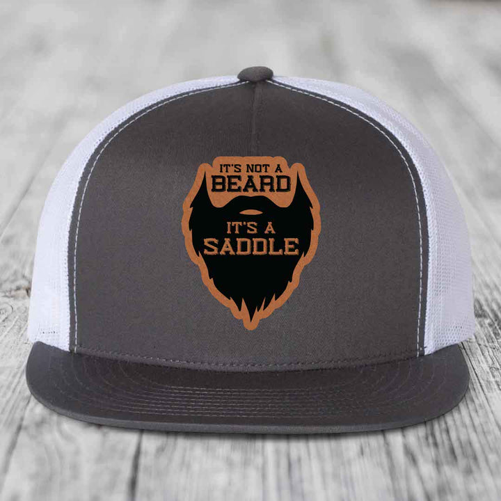 Its Not A Beard, Its A Saddle - Leather Patch Hat - Rawhide to Black Patch - Yupoong 6006 Snapback Flatbill Hat