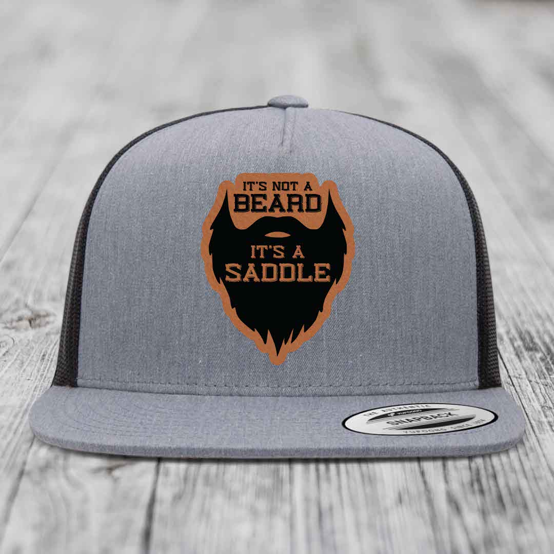 Its Not A Beard, Its A Saddle - Leather Patch Hat - Rawhide to Black Patch - Yupoong 6006 Snapback Flatbill Hat