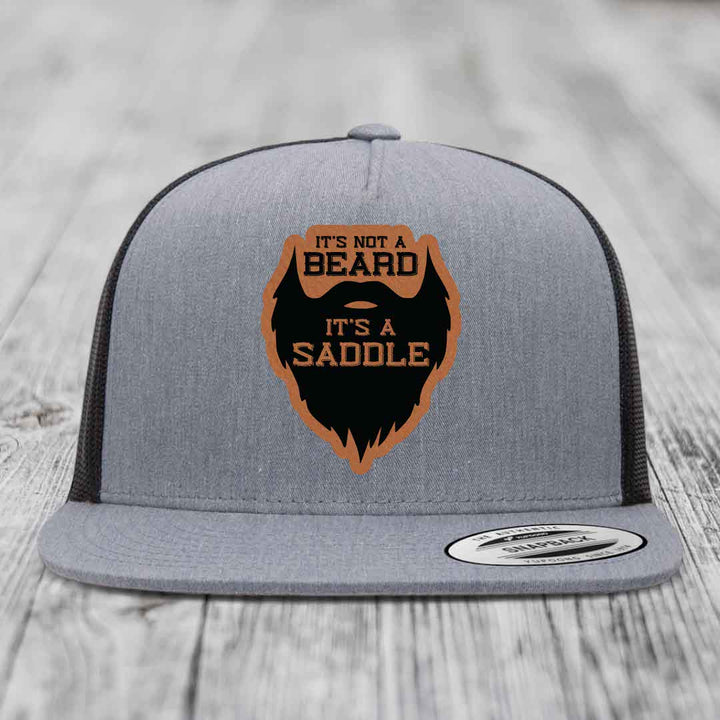 Its Not A Beard, Its A Saddle - Leather Patch Hat - Rawhide to Black Patch - Yupoong 6006 Snapback Flatbill Hat