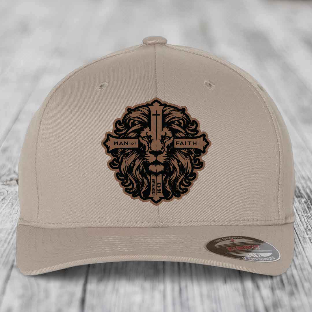 Beige baseball cap with brown and black lion head patch reading &
