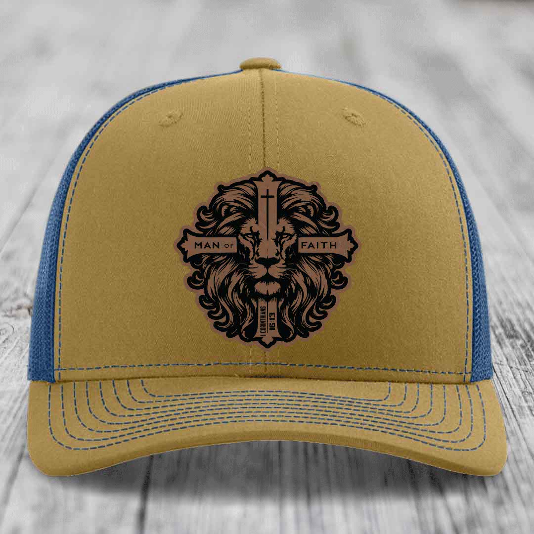 Tan and blue trucker hat with a lion head patch reading &
