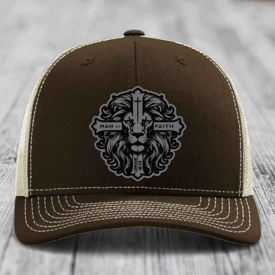 Brown trucker hat with white stitching and a black lion head patch reading &