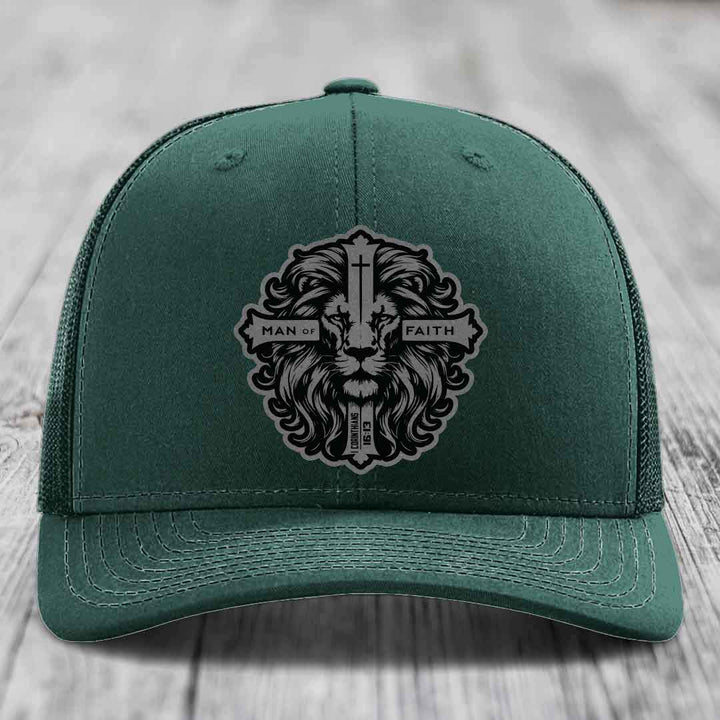 Green trucker hat with black and grey lion patch reading &
