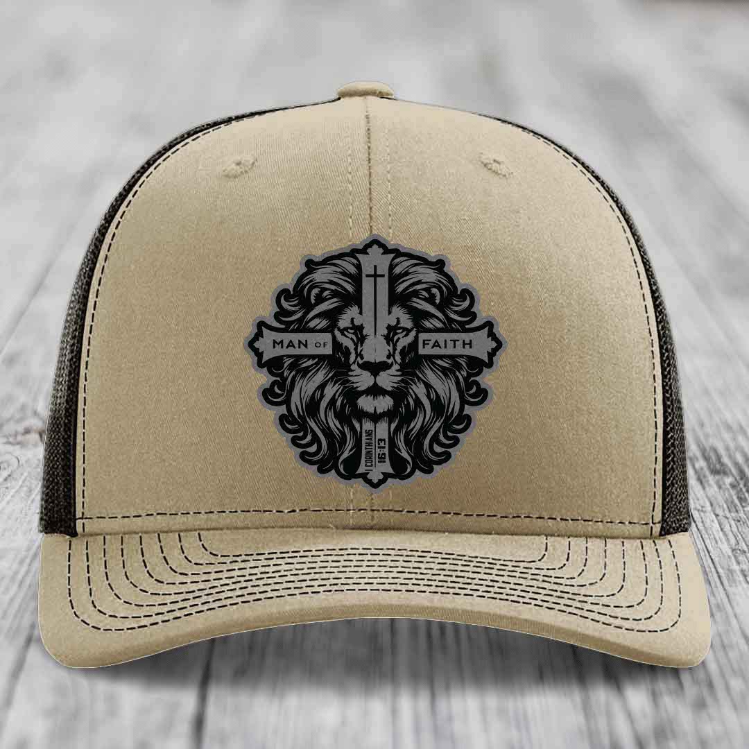 Beige trucker hat with black lion patch reading &