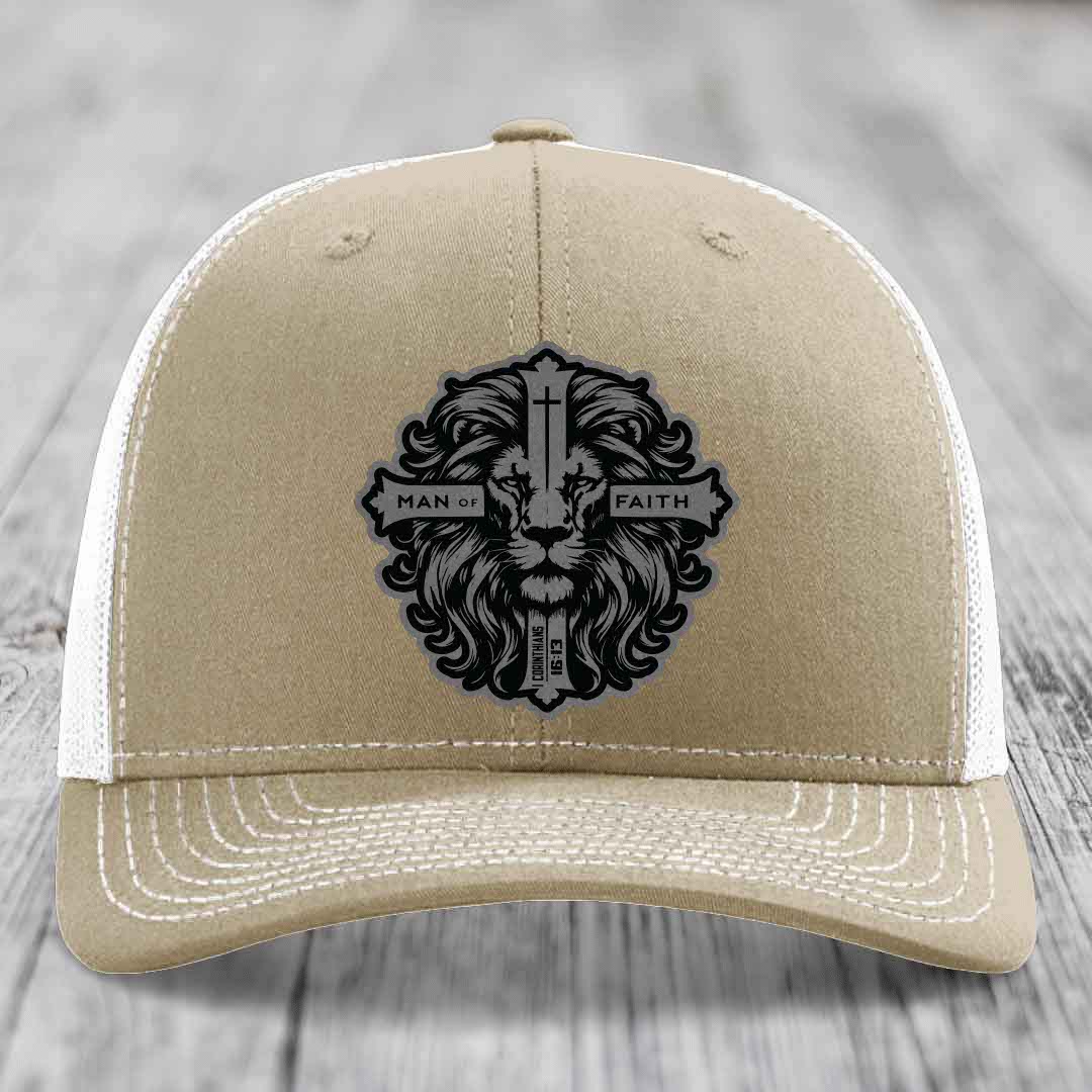 Tan trucker hat with black lion and cross patch reading &