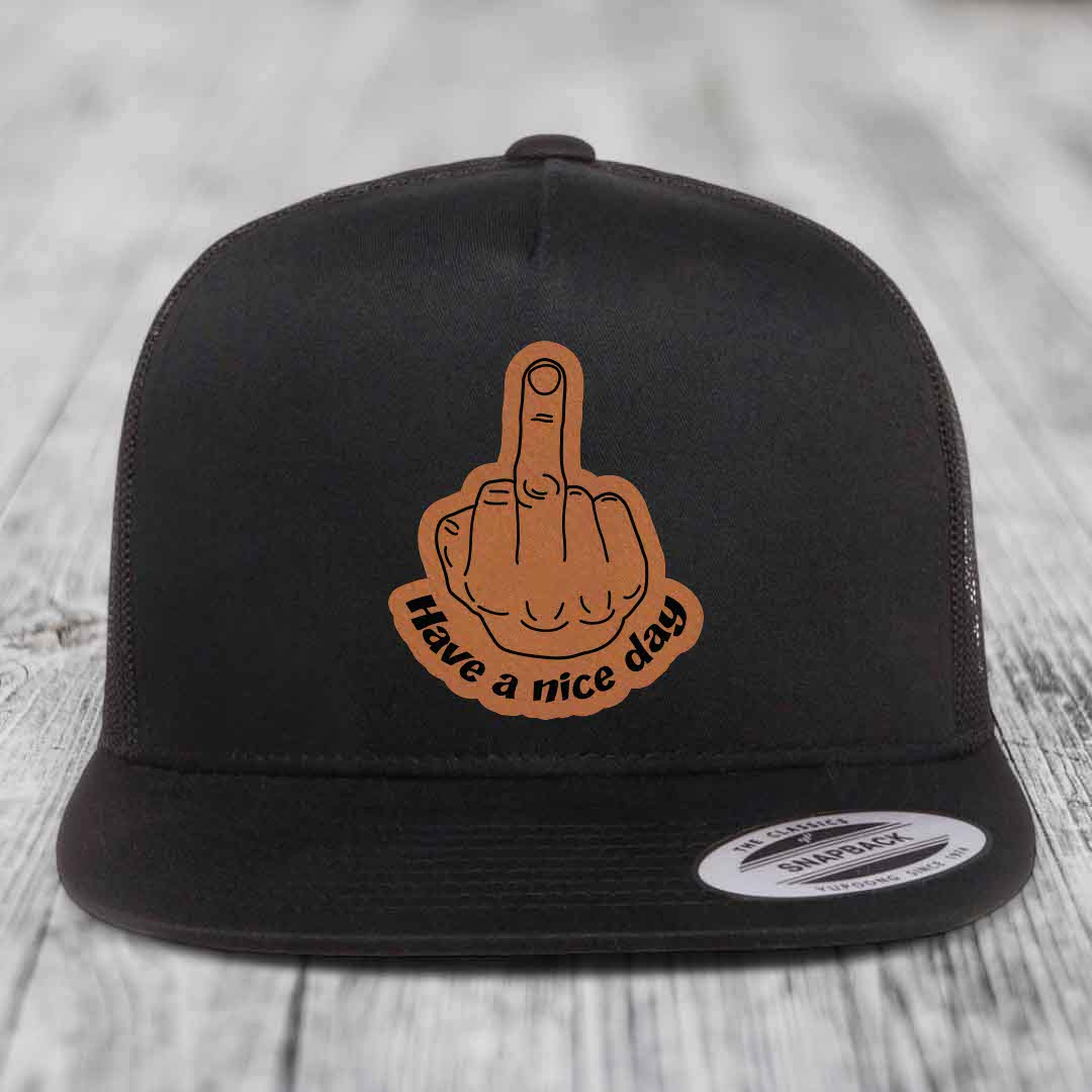 Black trucker hat with brown leatherette patch of middle finger and text &