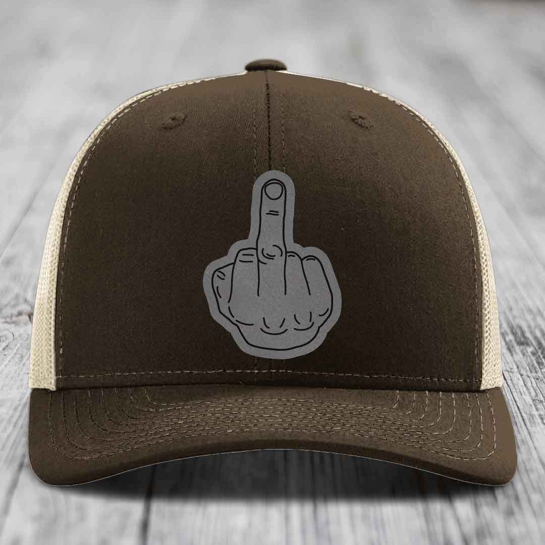 Brown trucker hat with a grey middle finger patch on the front.