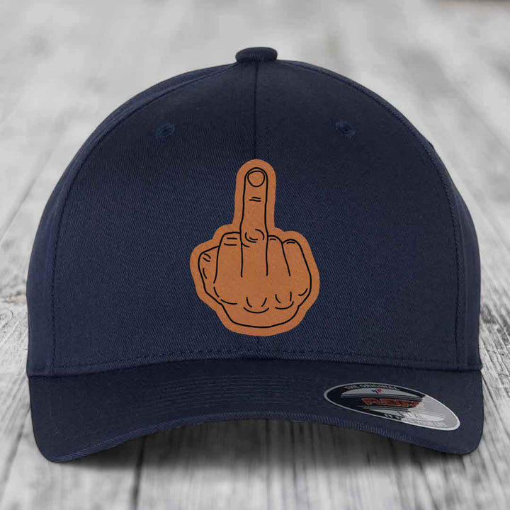 Dark blue baseball cap with a brown leatherette patch of a middle finger gesture.