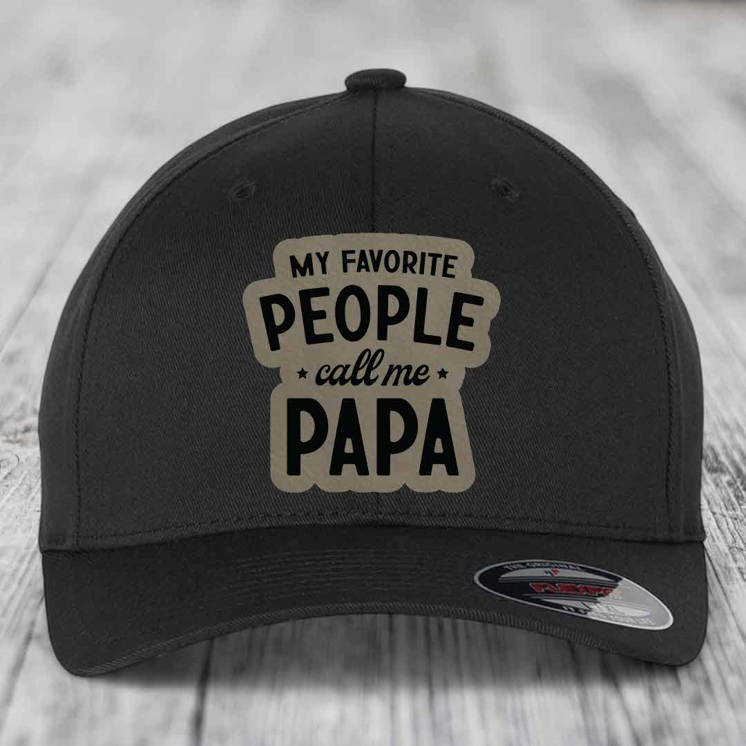 Black baseball cap with beige patch reading &