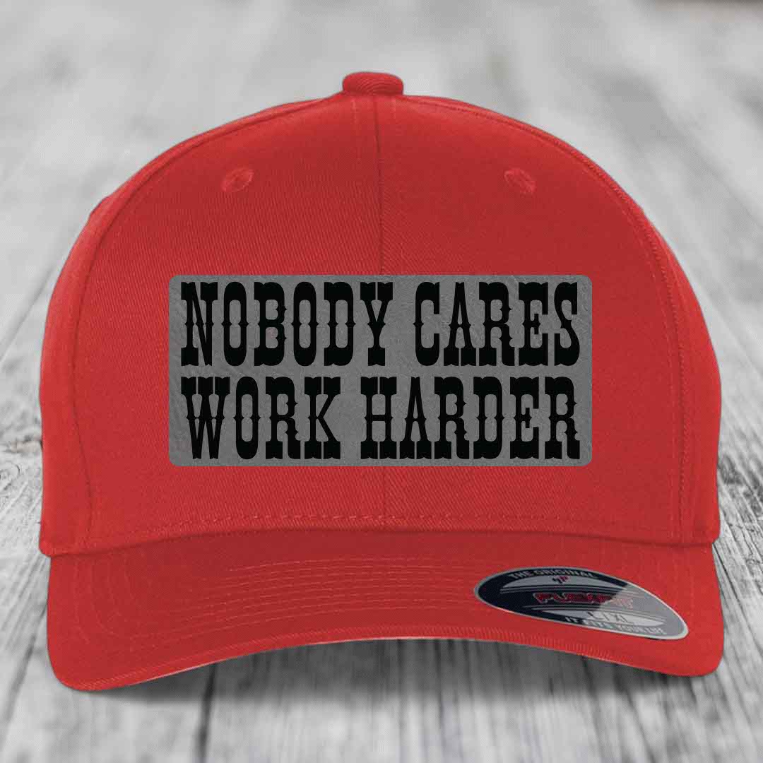 Red baseball cap with gray patch reading &