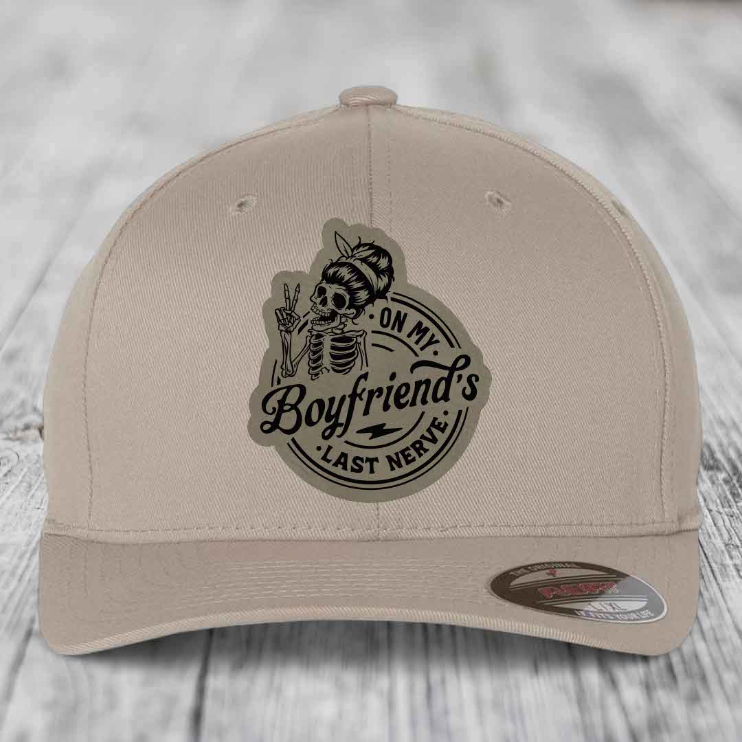 Beige baseball cap with black &