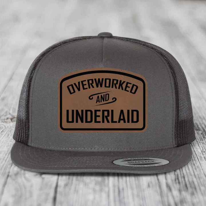 Overworked and Underlaid - Leather Patch Hat - Dark Brown to Black Patch - Yupoong 6006 Snapback Flatbill Hat