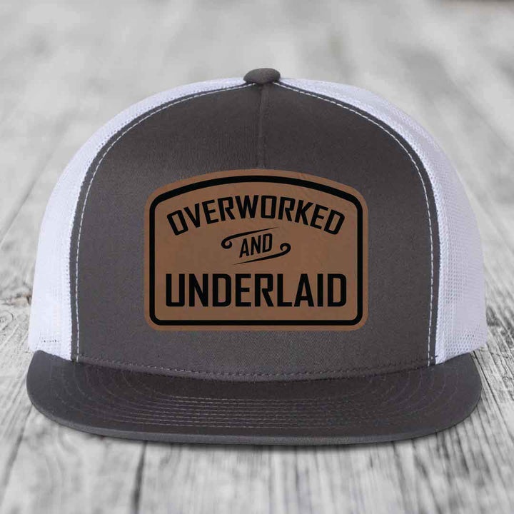 Overworked and Underlaid - Leather Patch Hat - Dark Brown to Black Patch - Yupoong 6006 Snapback Flatbill Hat