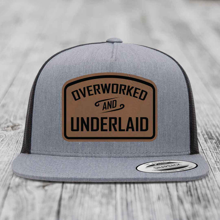 Overworked and Underlaid - Leather Patch Hat - Dark Brown to Black Patch - Yupoong 6006 Snapback Flatbill Hat