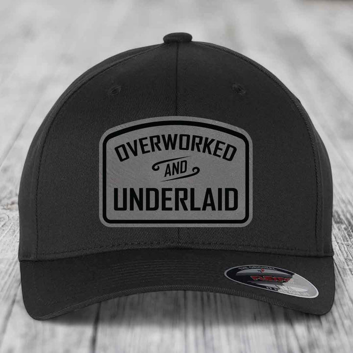 Overworked and Underlaid - Leather Patch Hat - Grey to Black Patch - Flexfit 6277 Fitted Hat