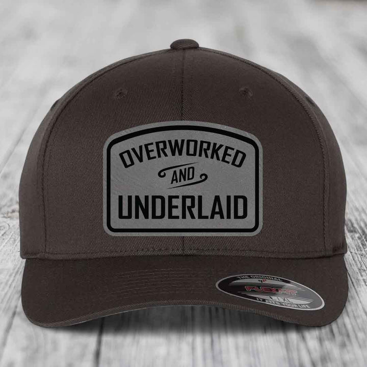 Overworked and Underlaid - Leather Patch Hat - Grey to Black Patch - Flexfit 6277 Fitted Hat