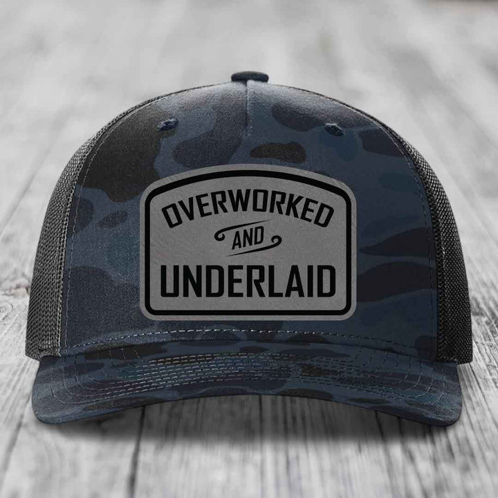 Overworked and Underlaid - Leather Patch Hat - Grey to Black Patch - Richardson 112PFP Snapback Trucker Hat
