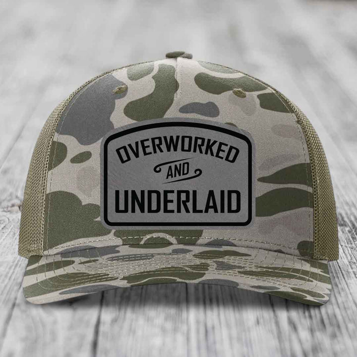 Overworked and Underlaid - Leather Patch Hat - Grey to Black Patch - Richardson 112PFP Snapback Trucker Hat