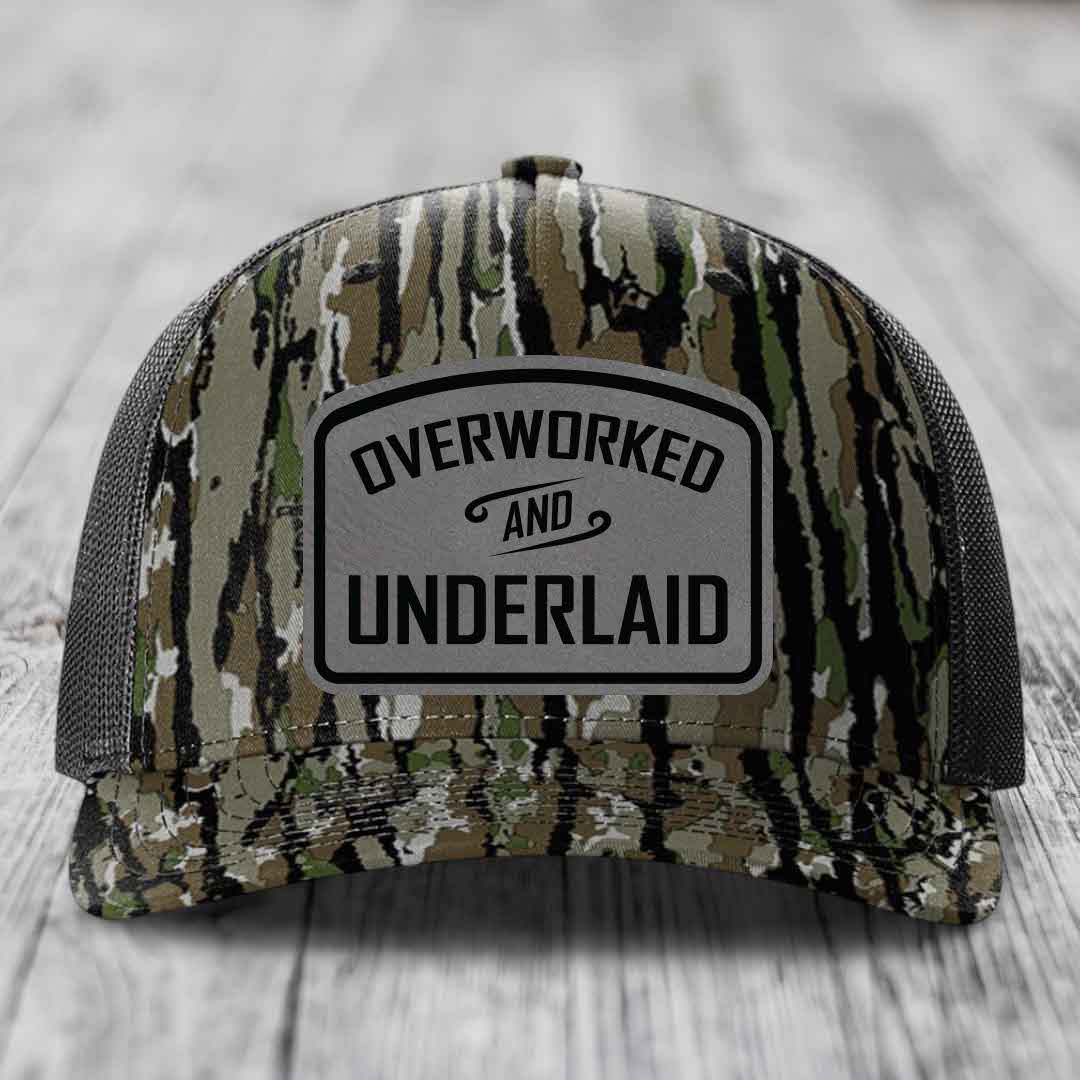 Overworked and Underlaid - Leather Patch Hat - Grey to Black Patch - Richardson 112PFP Snapback Trucker Hat
