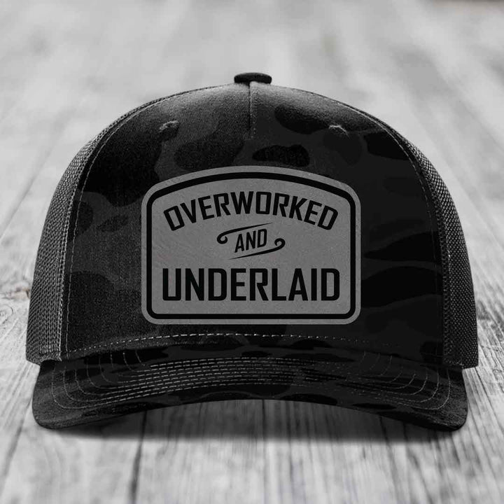 Overworked and Underlaid - Leather Patch Hat - Grey to Black Patch - Richardson 112PFP Snapback Trucker Hat