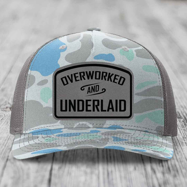 Overworked and Underlaid - Leather Patch Hat - Grey to Black Patch - Richardson 112PFP Snapback Trucker Hat