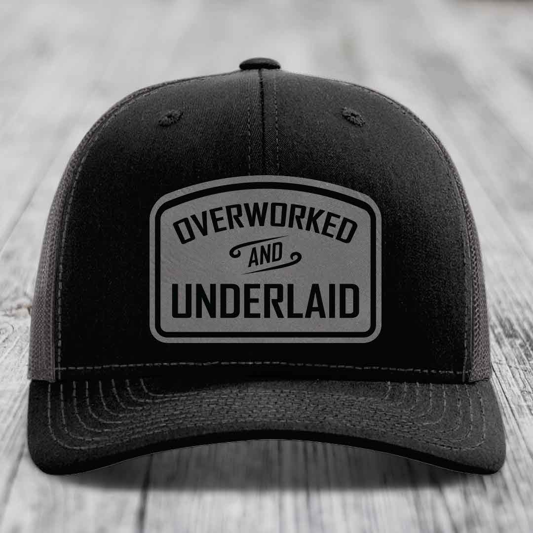 Overworked and Underlaid - Leather Patch Hat - Grey to Black Patch - Richardson 112 Snapback Trucker Hat