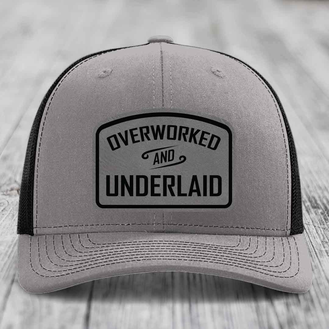 Overworked and Underlaid - Leather Patch Hat - Grey to Black Patch - Richardson 112 Snapback Trucker Hat