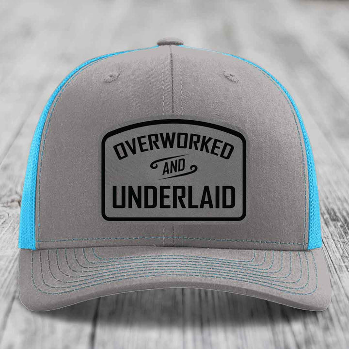 Overworked and Underlaid - Leather Patch Hat - Grey to Black Patch - Richardson 112 Snapback Trucker Hat