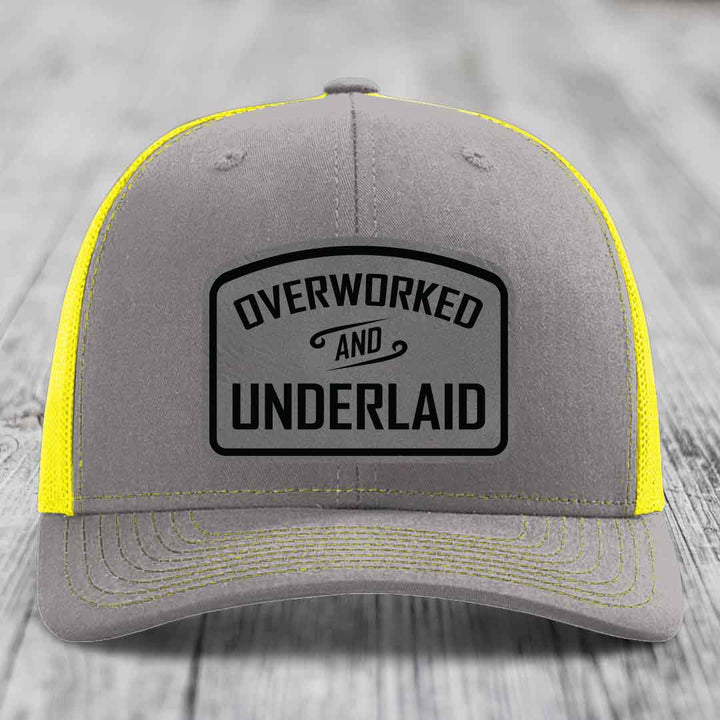 Overworked and Underlaid - Leather Patch Hat - Grey to Black Patch - Richardson 112 Snapback Trucker Hat