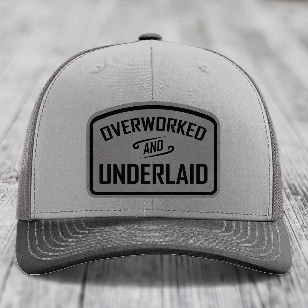 Overworked and Underlaid - Leather Patch Hat - Grey to Black Patch - Richardson 112 Snapback Trucker Hat