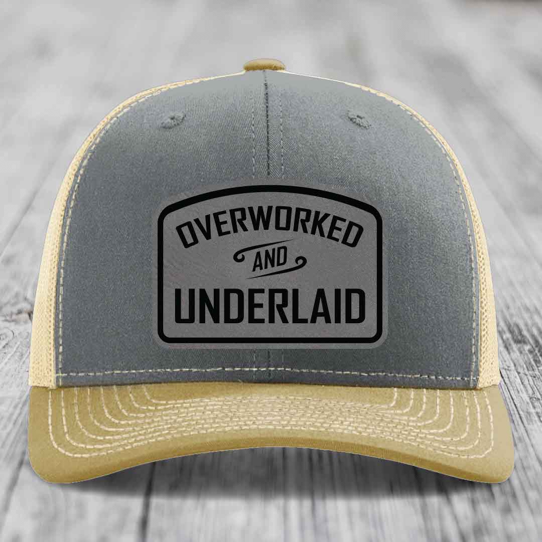 Overworked and Underlaid - Leather Patch Hat - Grey to Black Patch - Richardson 112 Snapback Trucker Hat