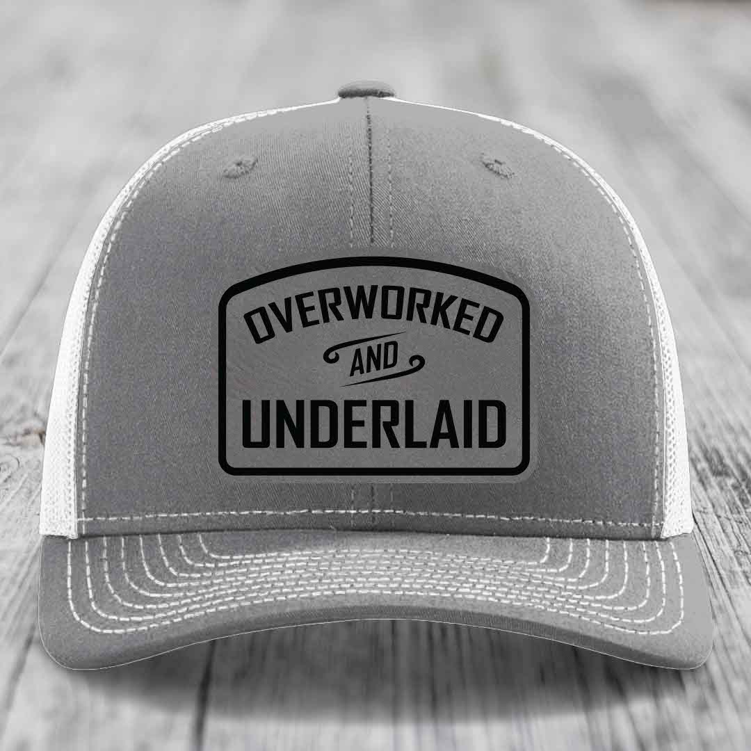 Overworked and Underlaid - Leather Patch Hat - Grey to Black Patch - Richardson 112 Snapback Trucker Hat