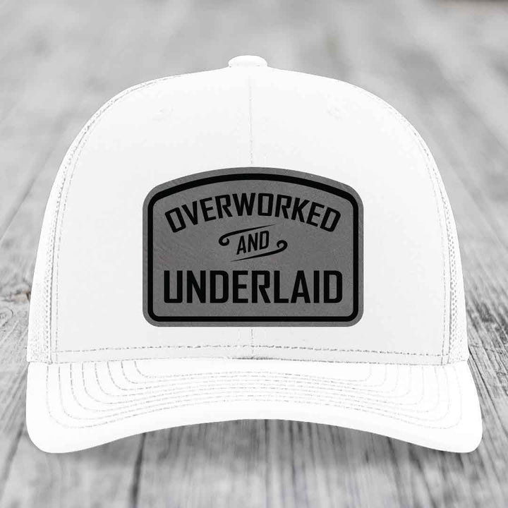 Overworked and Underlaid - Leather Patch Hat - Grey to Black Patch - Richardson 112 Snapback Trucker Hat