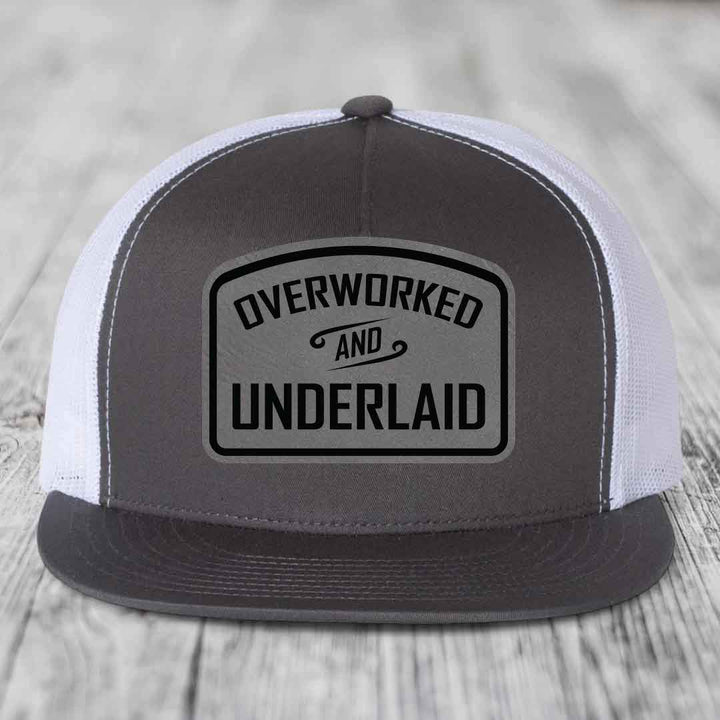 Overworked and Underlaid - Leather Patch Hat - Grey to Black Patch - Yupoong 6006 Snapback Flatbill Hat