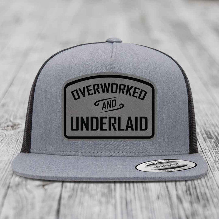 Overworked and Underlaid - Leather Patch Hat - Grey to Black Patch - Yupoong 6006 Snapback Flatbill Hat