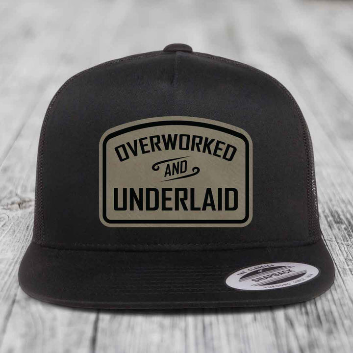 Overworked and Underlaid - Leather Patch Hat - Light Brown to Black Patch - Yupoong 6006 Snapback Flatbill Hat